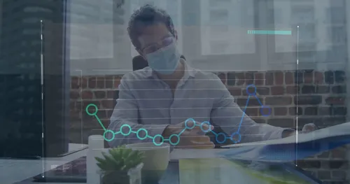 Image of graph over caucasian male doctor wearing mask analyzing reports on desk in hospital